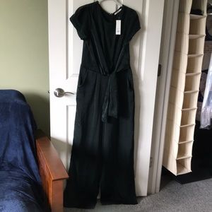 NWT. Mi Ami  Francesca’s green polyester jumpsuit. Size L